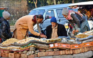 People busy purchasing dry fruits from vendor at Jail Road