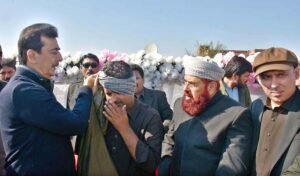 Chairman Senate Syed Yusuf Raza Gilani offering dua on the death of Malik Haji Manwar Hayat Sandila, at Basti Jhonk.