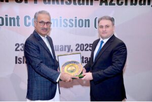 Azerbaijan's Minister for Defence Industry, H.E. Vugar Mustafayev, presenting souvenir to Federal Secretary Economic Affairs, Dr. Kazim Niaz, on the occasion of Pakistan-Azerbaijan 8th Joint Commission Meeting.