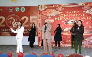Students performing tableau on the stage during Chinese Spring Festival in connection with Chinese New Year 2025 at University Of Agriculture Faisalabad (UAF)