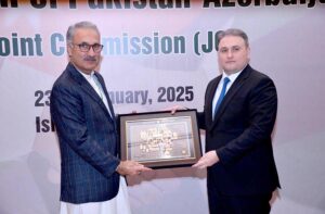 Azerbaijan's Minister for Defence Industry, H.E. Vugar Mustafayev, presenting souvenir to Federal Secretary Economic Affairs, Dr. Kazim Niaz, on the occasion of Pakistan-Azerbaijan 8th Joint Commission Meeting.