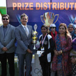 GOC strategic force south Major General Shahid Abro giving away trophy winner trophy to student during sports festival’25 at Public School Sports complex