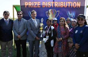 GOC strategic force south Major General Shahid Abro giving away trophy winner trophy to student during sports festival’25 at Public School Sports complex
