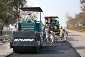 NHA workers with the help of modern and heavy machinery repairing the Motorway Road to make the journey comfortable for commuters