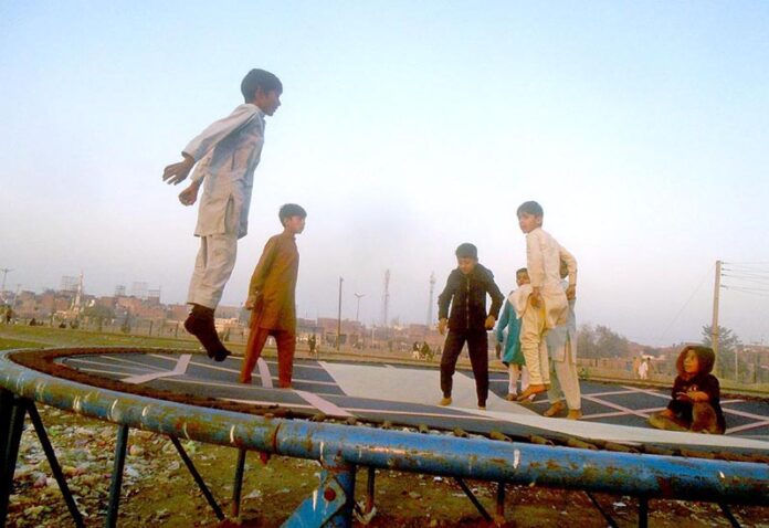 Youngsters enjoy jumping on trampoline