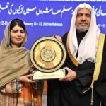 Secretary General of the Muslim World League, Sheikh Dr. Mohammed bin Abdulkarim al-Issa presenting shield to Nobel Peace Prize Laureate, Malala Yousafzai at the closing ceremony of the International Conference on Girls' Education at Jinnah Convention Centre