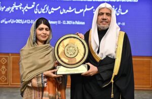 Secretary General of the Muslim World League, Sheikh Dr. Mohammed bin Abdulkarim al-Issa presenting shield to Nobel Peace Prize Laureate, Malala Yousafzai at the closing ceremony of the International Conference on Girls' Education at Jinnah Convention Centre