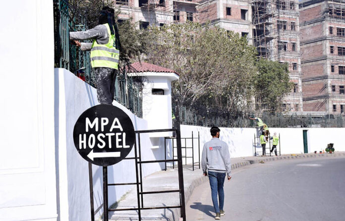 Labourers busy in construction work of MPA Hostel Punjab Assembly