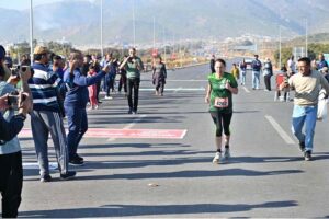 A woman reached the finishing line as a large number of people participated in the Islamabad Marathon 2025 organized by “Islamabad Run with Us