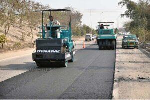 NHA workers with the help of modern and heavy machinery repairing the Motorway Road to make the journey comfortable for commuters