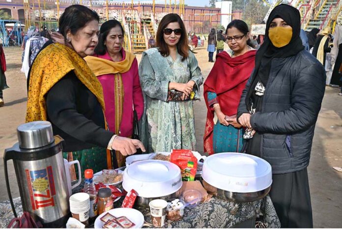 Senior Vice President of Women Chamber of Commerce, Gulzeb Waqas Malik, Principal Professor Zeba Zahoor are inspecting the stalls at the four-day Cultural Day Bazaar at Government Allama Iqbal Graduate College for Women