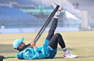 Pakistan's Muhammad Rizwan warming up before a practice session at Multan Cricket Stadium, ahead of their first Test cricket match against the West Indies.