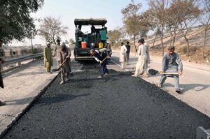 NHA workers with the help of modern and heavy machinery repairing the Motorway Road to make the journey comfortable for commuters