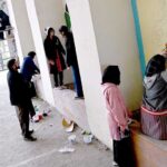 Students are busy painting vibrant artwork to enhance the beauty of the wall on the Zero Point Bridge in the Federal Capital