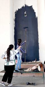 Students are busy painting vibrant artwork to enhance the beauty of the wall on the Zero Point Bridge in the Federal Capital