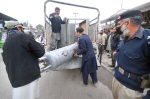 Town 1 officials load hotel cylinders from a hostel into a truck during an encroachment operation at Haji Camp near Children’s Hospital in Peshawar.