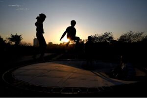 Children enjoy jumping on trampoline near G-7 in the Federal Capital