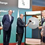 Prime Minister Muhammad Shehbaz Sharif rings the ceremonial gong during his visit to Pakistan Stock Exchange