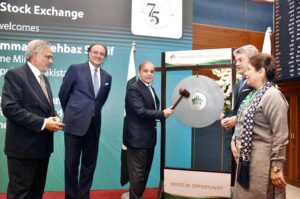 Prime Minister Muhammad Shehbaz Sharif rings the ceremonial gong during his visit to Pakistan Stock Exchange