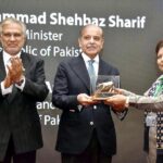 Prime Minister Muhammad Shehbaz Sharif receives a souvenir from Chairperson PSE Ms. Shamshad Akhtar during his visit to Pakistan Stock Exchange