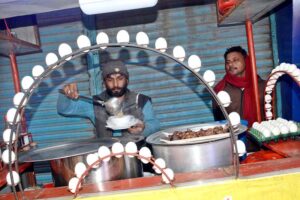 A soup vendor near Golmandi Food Street is attracting customers with hot Chicken soups during the winter season.