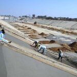 Irrigation department workers busy lining the Karachi canal originating from the Indus River
