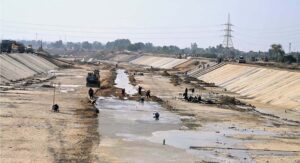 Irrigation department workers busy lining the Karachi canal originating from the Indus River