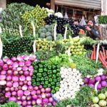 A vendor displaying the fresh vegetables to attract the customers at Lahori Mohalla