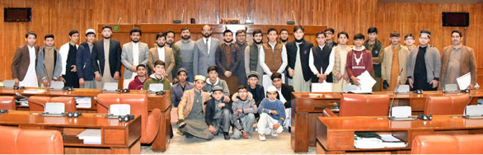 Group photo of students and faculty members from Iqra Rauza Tulatfalsystem Akora Khattak, visiting Senate Hall at Parliament House