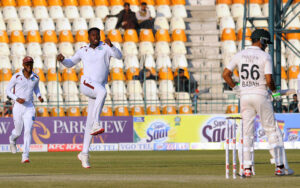West Indies' Kevin Sinclair celebrate with teammates after taking the wicket of Pakistan's Babar Azam during the second day of the second Test cricket match between Pakistan and West Indies at the Multan Cricket Stadium