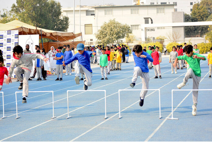 Students are participating in different games during annual Sports day of The City School at Public Sports Ground