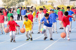 Students are participating in different games during annual Sports day of The City School at Public Sports Ground