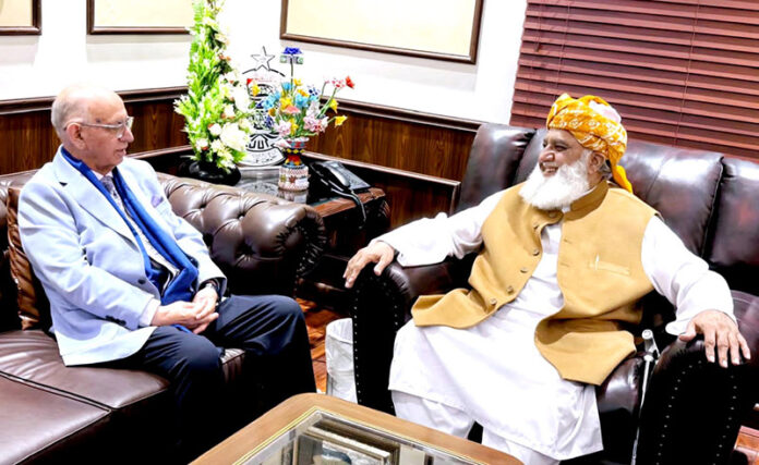 Senator Irfan-ul-Haq Siddiqui, spokesperson for the government negotiation committee, meets with JUI-F chief Maulana Fazlur Rehman at his residence