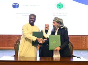 Secretary General of the Muslim World League, Sheikh Dr. Mohammed bin Abdulkarim al-Issa, witnesses Signing of International Partnership Agreements between Adviser to the Muslim world League, Maulana Hamid ul Haq Haqqani with Secretary General of the International Islamic Fiqh Academy, Prof Koutoub Moustapha Sano during Closing ceremony of the International Conference Girls Education at Jinnah convention Centre