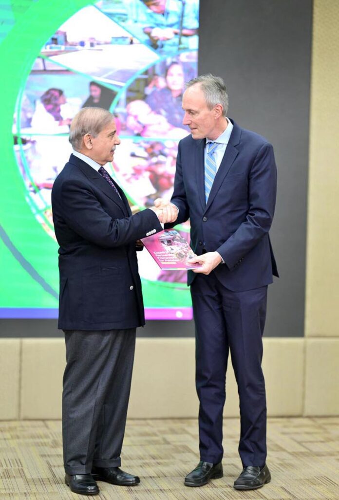 Vice President World Bank for South Asia, Martin Raiser, presenting a copy of booklet of World Bank's Country Partnership Framework for Pakistan to Prime Minister Muhammad Shehbaz Sharif at a ceremony