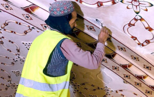 Laborers busy restoration work at Badshahi Masjid