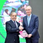 Vice President World Bank for South Asia, Martin Raiser, presenting a copy of booklet of World Bank's Country Partnership Framework for Pakistan to Prime Minister Muhammad Shehbaz Sharif at a ceremony