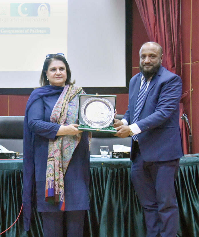 Additional Director Civil Services Academy Dr Syed Shabbir Akbar Zaidi presenting shield to Chairperson Benazir Income Support Program, Senator Rubina Khalid in BISP Headquarters