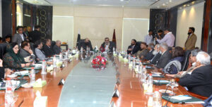 Senator Amir Waliuddin Chishti, Chairman of the Senate Standing Committee on National Health Services, Regulations, and Coordination, presides over a committee meeting at the College of Physicians and Surgeons of Pakistan.