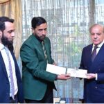 Prime Minister Muhammad Shehbaz Sharif presents a cheque of Rs 2.5 million to Muhammad Asif in recognition of his brilliant performance in winning the recent SAARC Snooker Championship