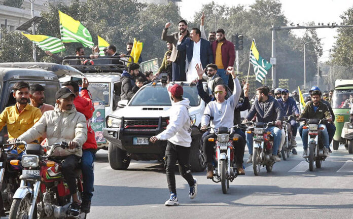 People gather on Mall Road to protest and mark Black Day, standing with Kashmiris on India's Republic Day