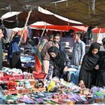 Women explore the Sasta Bazar, shopping for essential household items and making the most of the affordable prices to meet their daily needs