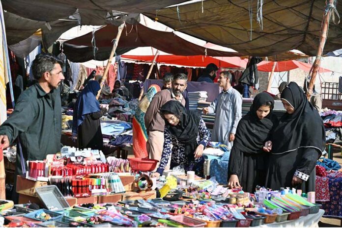 Women explore the Sasta Bazar, shopping for essential household items and making the most of the affordable prices to meet their daily needs