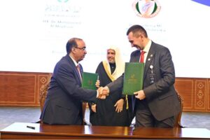 Secretary General of the Muslim World League, Sheikh Dr. Mohammed bin Abdulkarim al-Issa, witnesses Signing of International Partnership Agreements between Assistant to the Secretary General for Corporate Communications Muslim World League Dr. Mohammed Al-Majdouie with President of the International Public Chamber Alexander Olshevskiy during Closing ceremony of the International Conference Girls Education at Jinnah convention Centre