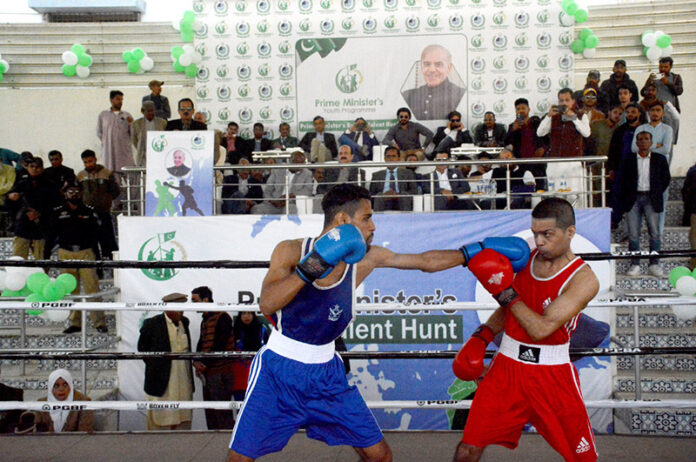 Chairman Prime Minister's Youth Programme Rana Mashhod Ahmed Khan watching boxing event at Prime Minister's Boxing Talen Hunt at Lyari's Kakri Ground