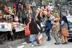 People busy selecting and purchasing second-hand toys from the vendors at weekly Bazaar