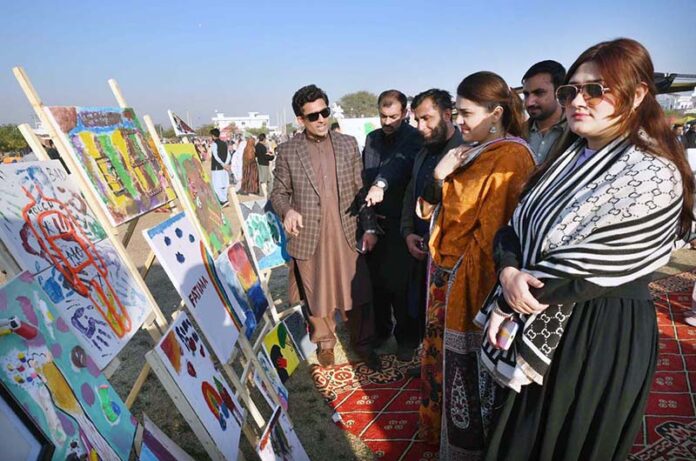 Child Protection Specialist UNICEF Muhammad Sohail visiting painting stall during the closing ceremony of PDA Food & Culture Family Festival with the support of UNICEF at Regi Model Town Park