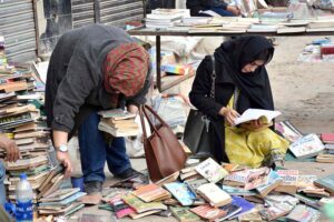 People busy selecting and purchasing second-hand toys from the vendors at weekly Bazaar