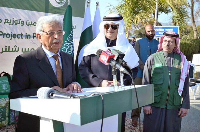 Federal Minister for National Food Security and Research Rana Tanveer Hussain addressing a ceremony as KSrelief launches major initiative to provide shelter NFIs and Winter Kits in Pakistan 2025 at Pakistan Sports Complex with Saudi Ambassador Nawaf Bin Said Al-Maliki