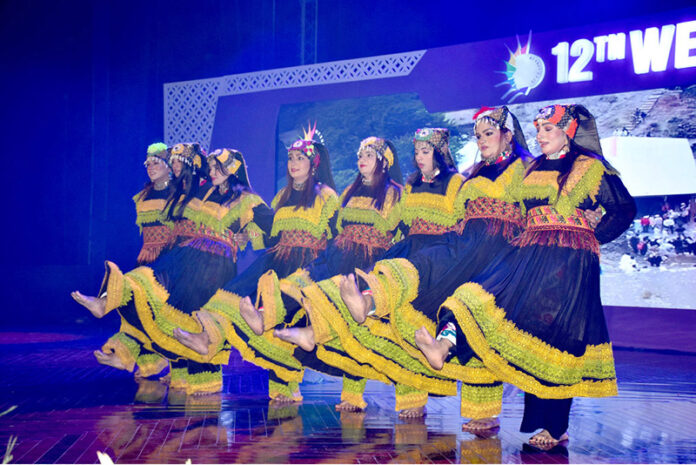 Artists enthusiastically present the cultural dance of Gilgit-Baltistan showcasing the diverse and vibrant heritage of Pakistan during the opening ceremony of the 12th Waxnet Exhibition 2025